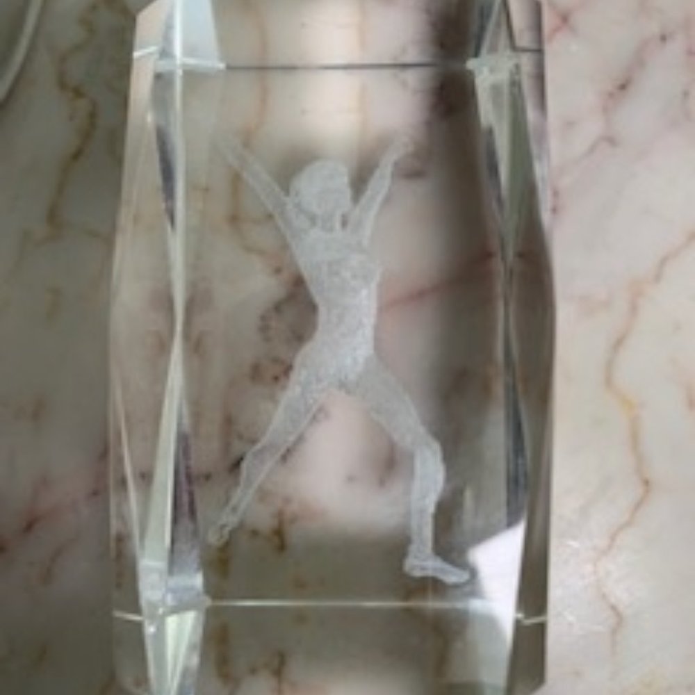 Clear crystal paperweight with gymnastics figure inside